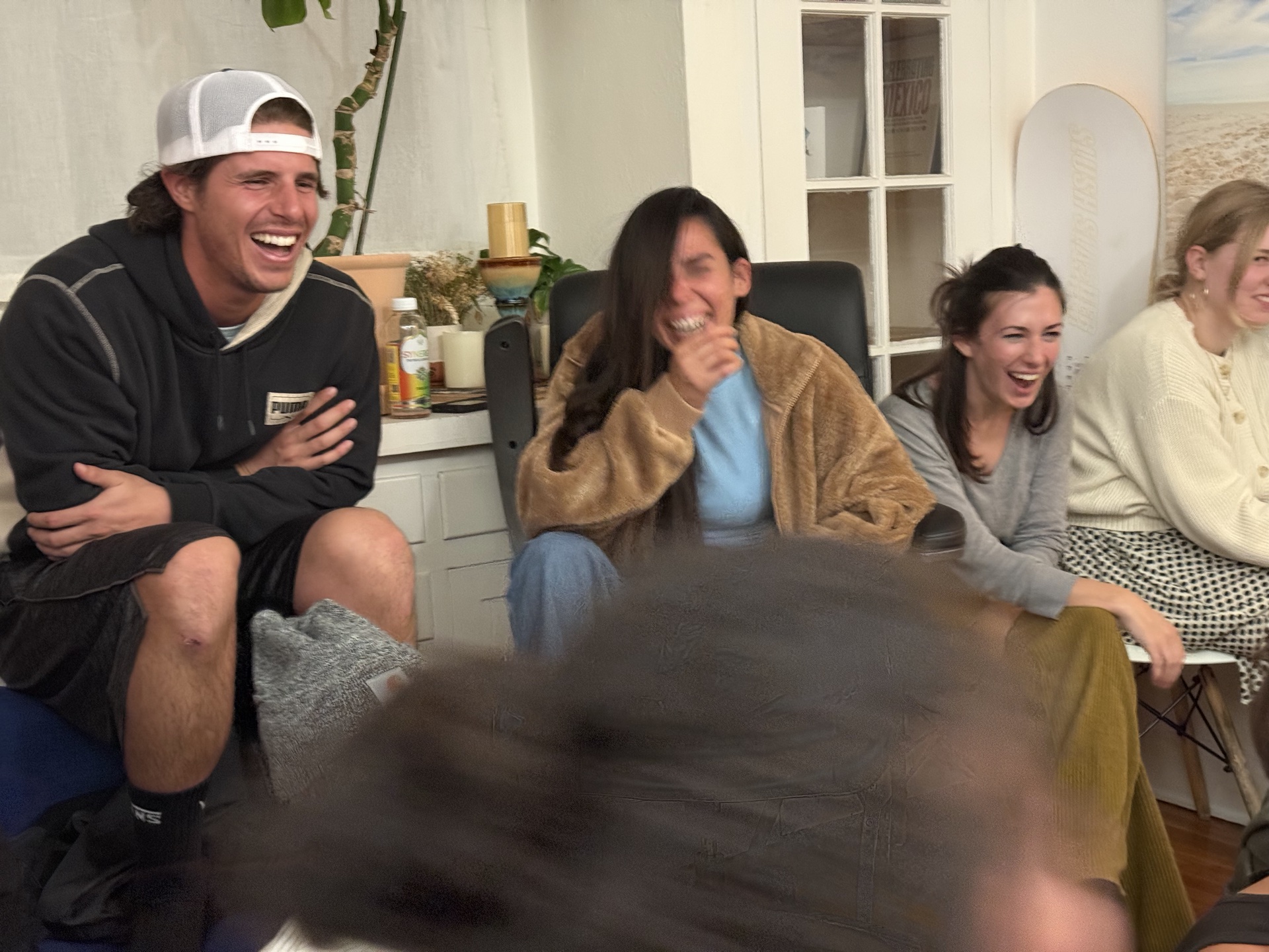 Workshop participants breaking into candid laughter