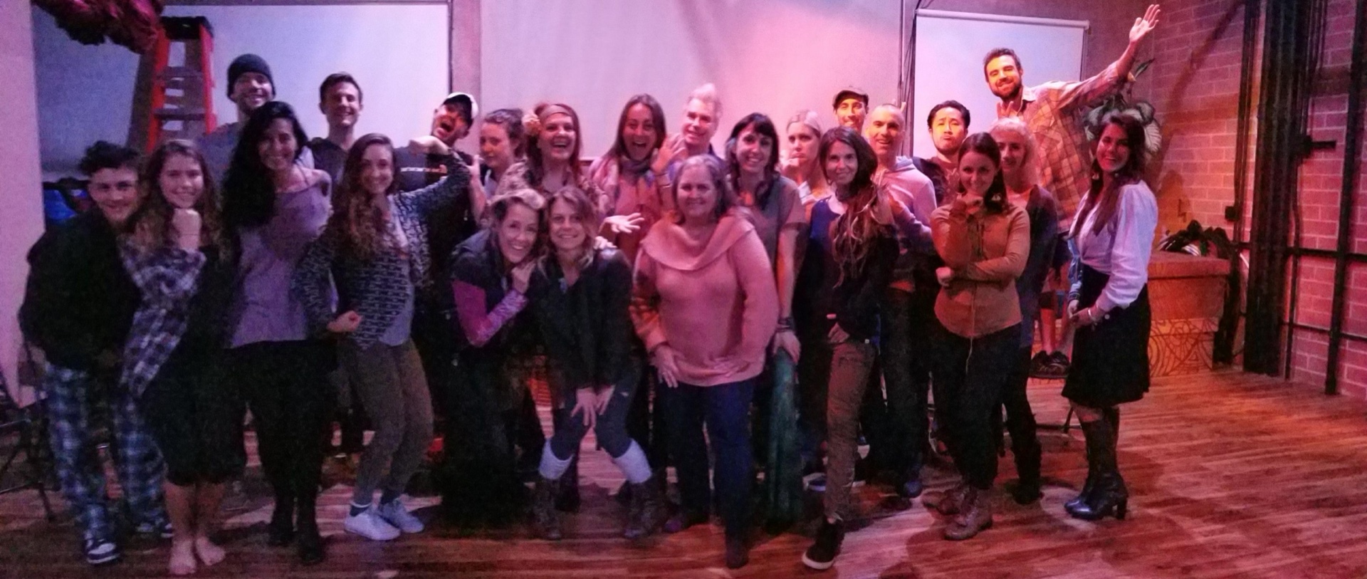 Wide shot of a warm, welcoming workshop group