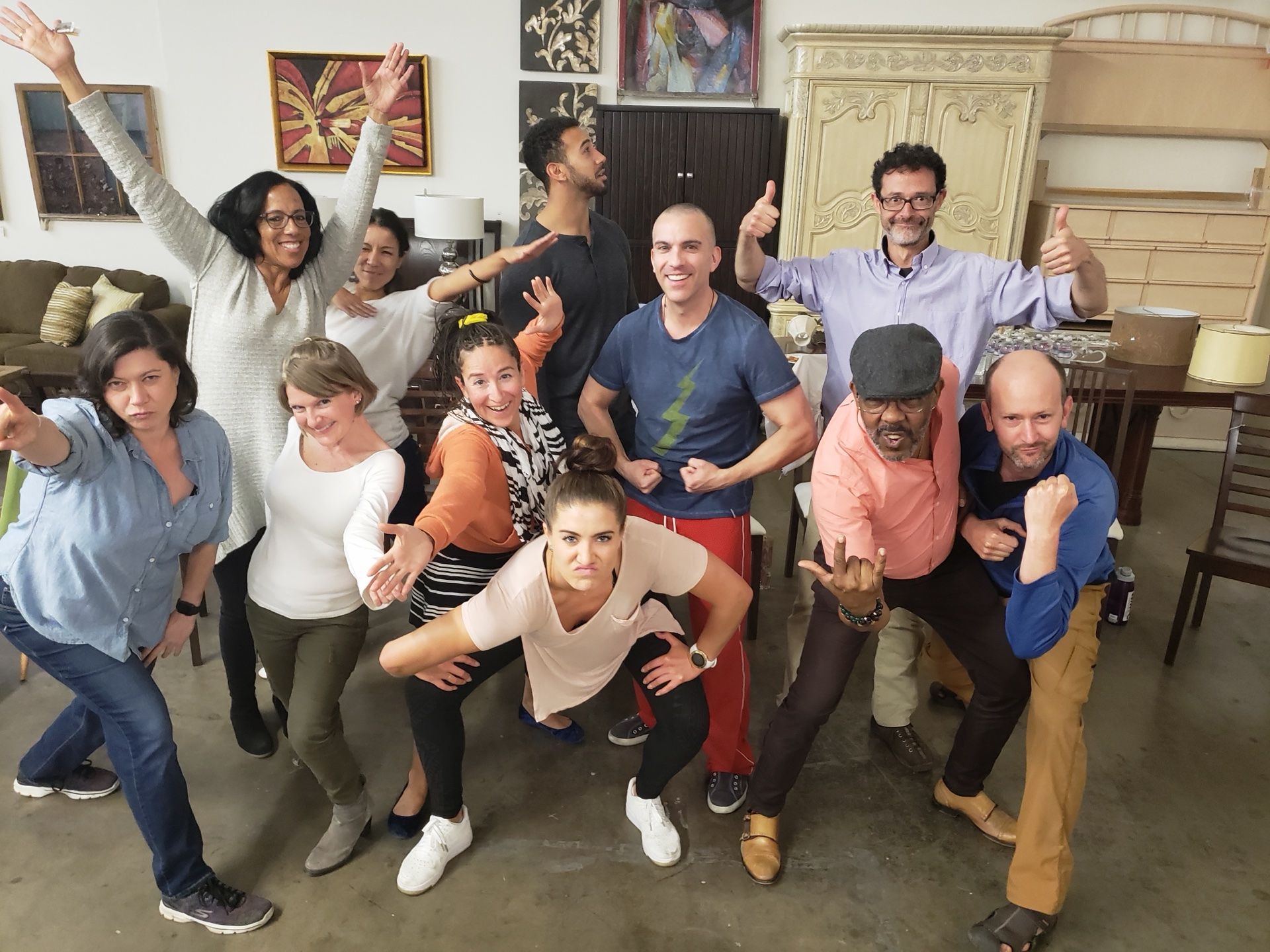 The whole class striking playful poses together